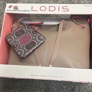 Brand new in box, light brown leather tote with wristlet